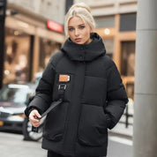 Manteau d’Hiver Femme Imperméable & Matelassé avec Capuche – Chaud, Chic & Résistant aux Intempéries